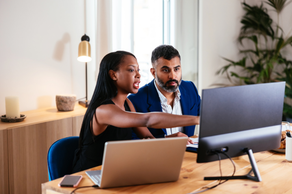 Accountants working together at a computer