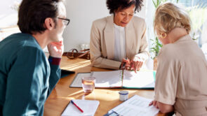 a financial advisor meeting with clients