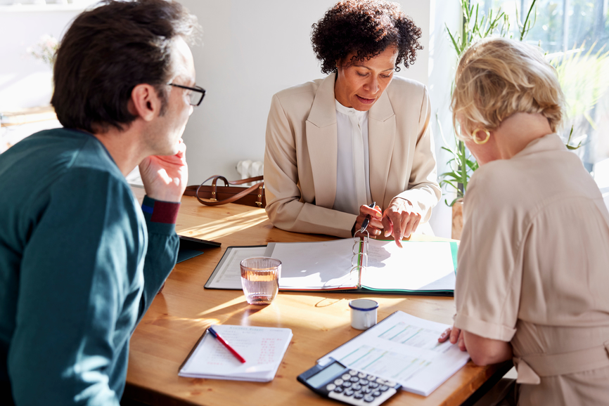 a financial advisor meeting with clients