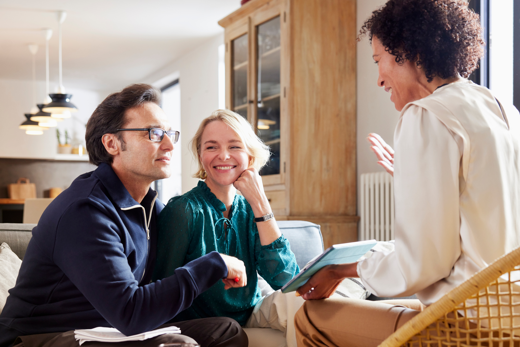 A couple meeting with a tax advisor in their home