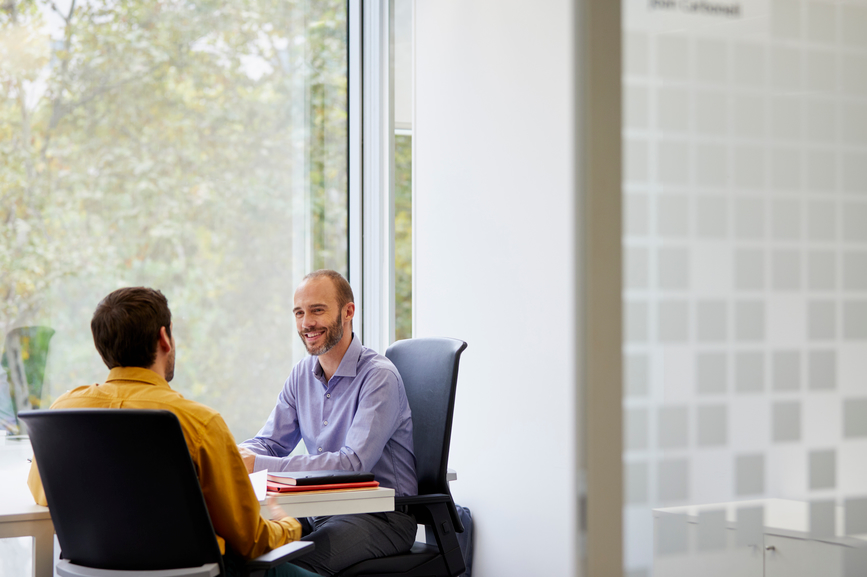 tax advisor meeting with a client in an office