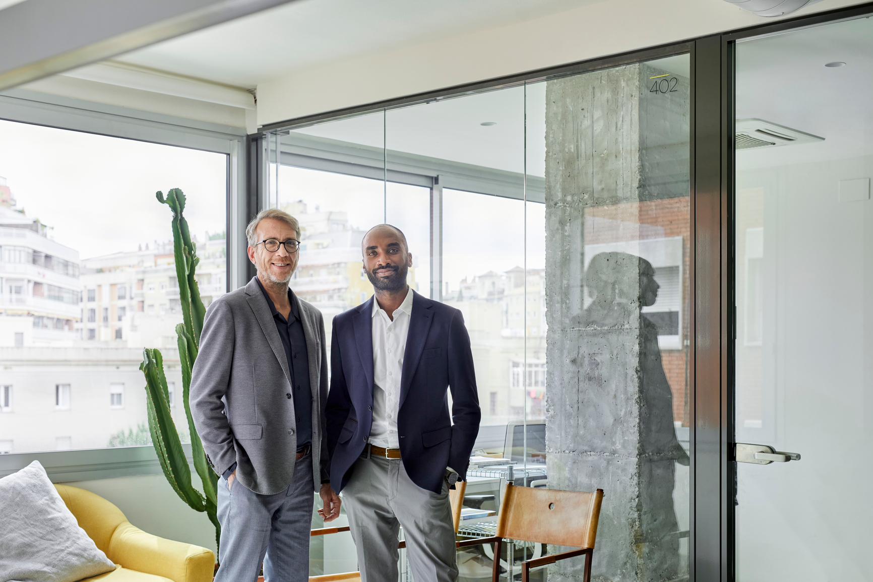 Business partners smiling standing together in an office
