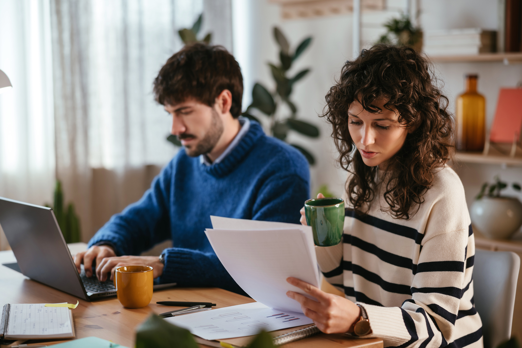 A couple reviewing documents in preparation for filing their taxes