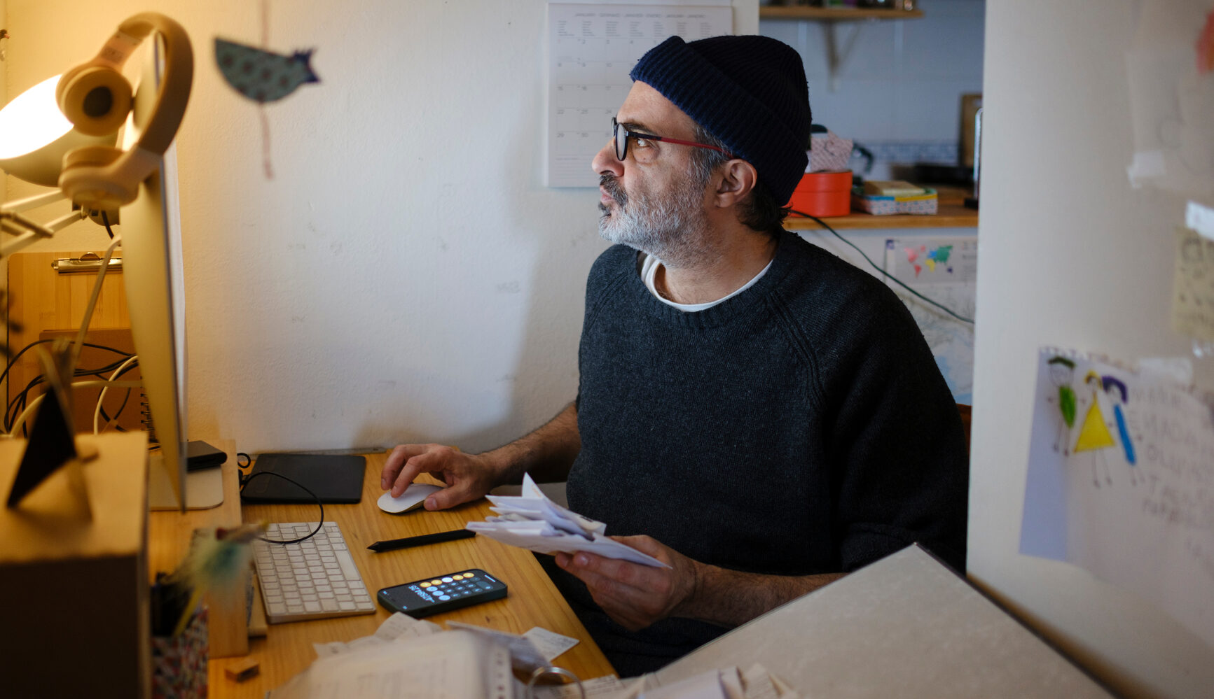 A small business owner working on their taxes from their home office