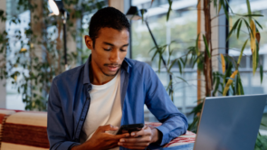 a young adult using his phone