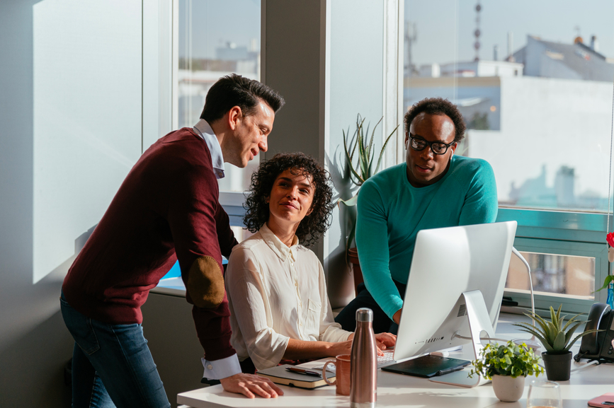Colleagues meeting at a computer