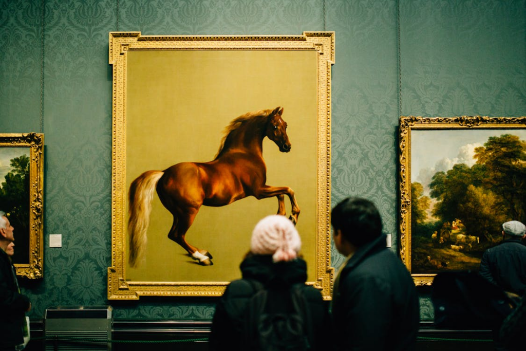 People observing fine art in a gallery