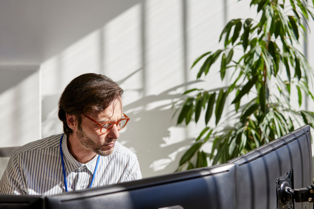 Businessman working on computers in the office
